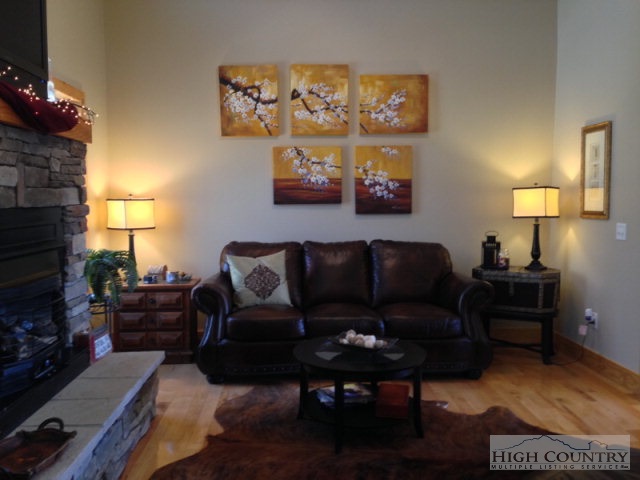 620 Green Knob Mountain Road Boone, NC 28607 - Photo 41 of 43 a living room with furniture and a fireplace