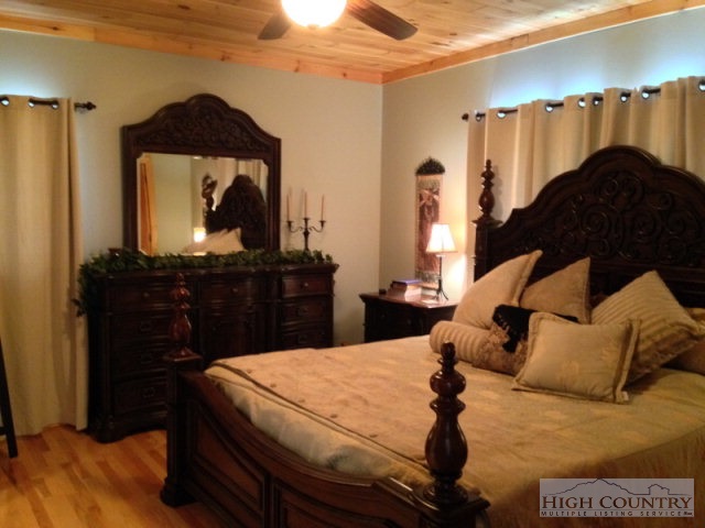620 Green Knob Mountain Road Boone, NC 28607 - Photo 7 of 43 a bed room with a bed and a television
