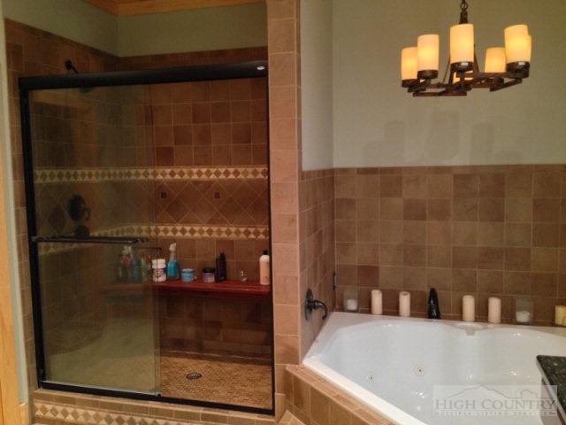 620 Green Knob Mountain Road Boone, NC 28607 - Photo 9 of 43 a bathroom with a bathtub