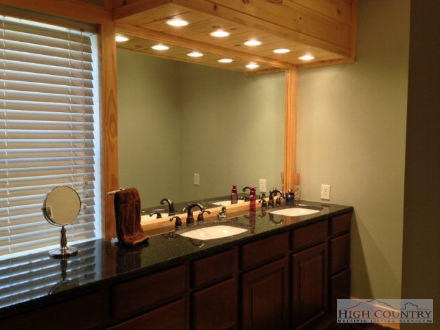 620 Green Knob Mountain Road Boone, NC 28607 - Photo 10 of 43 a bathroom with a sink and a mirror