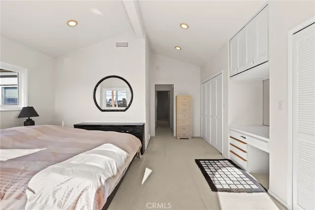 a bed room with a bed and a lamp