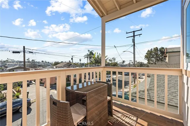a view of a balcony with chairs