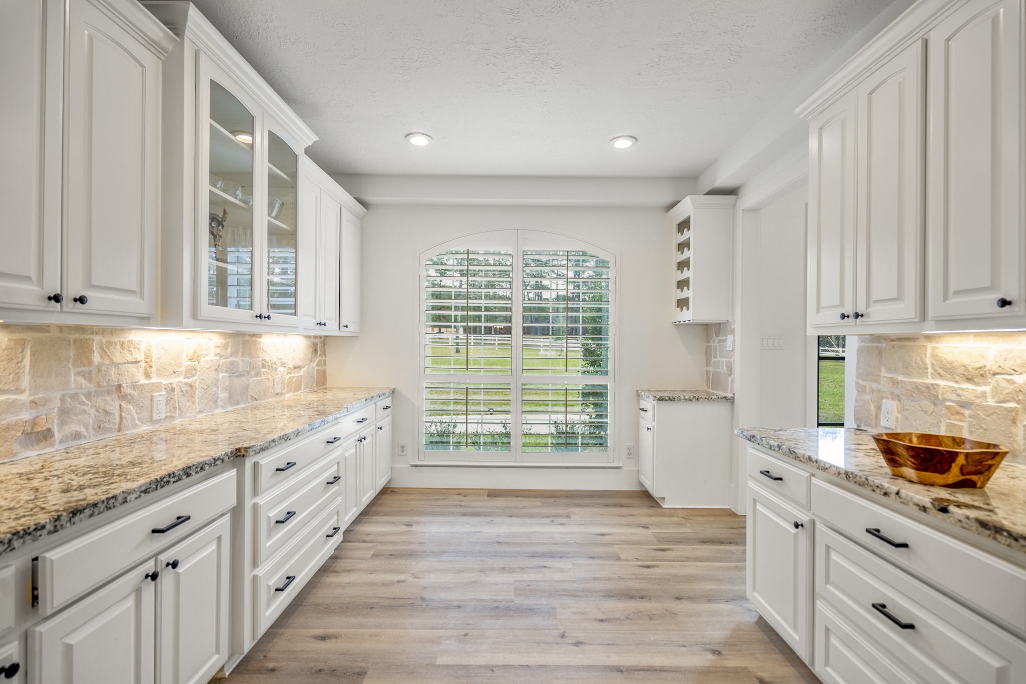31219 Edgewater Drive Magnolia, TX 77354 - Photo 12 of 49 a kitchen with granite countertop a large window and a sink