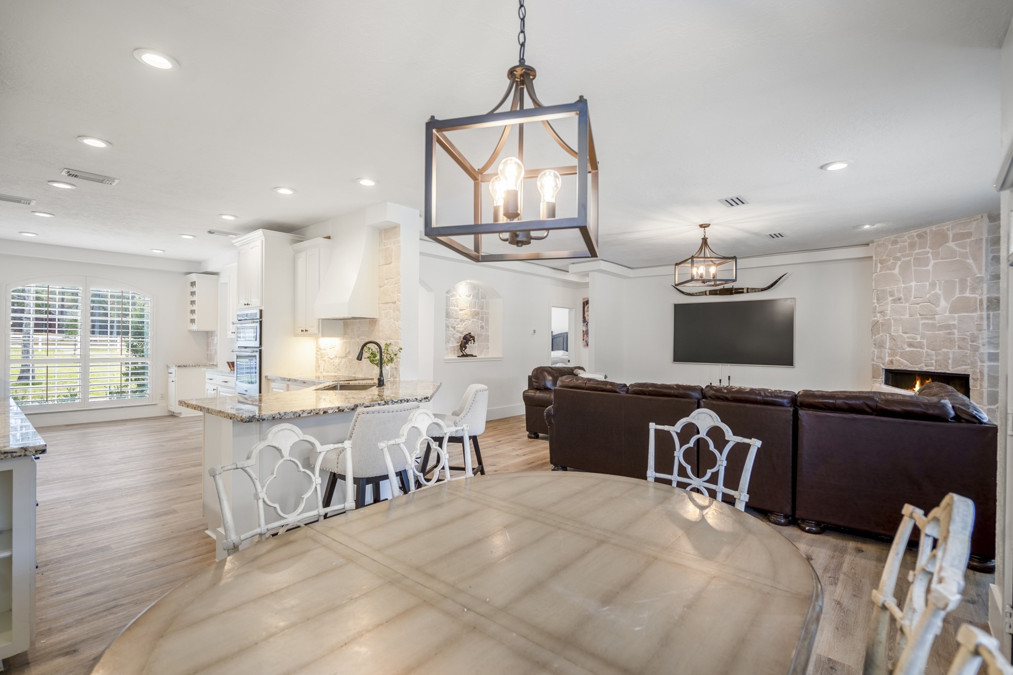 31219 Edgewater Drive Magnolia, TX 77354 - Photo 17 of 49 a view of kitchen with stainless steel appliances wooden floor dining table and chairs