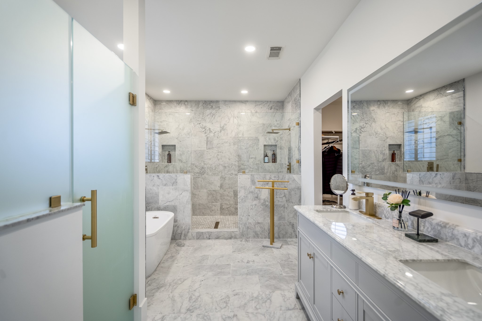 31219 Edgewater Drive Magnolia, TX 77354 - Photo 20 of 49 a bathroom with a granite countertop sink a mirror a toilet and shower