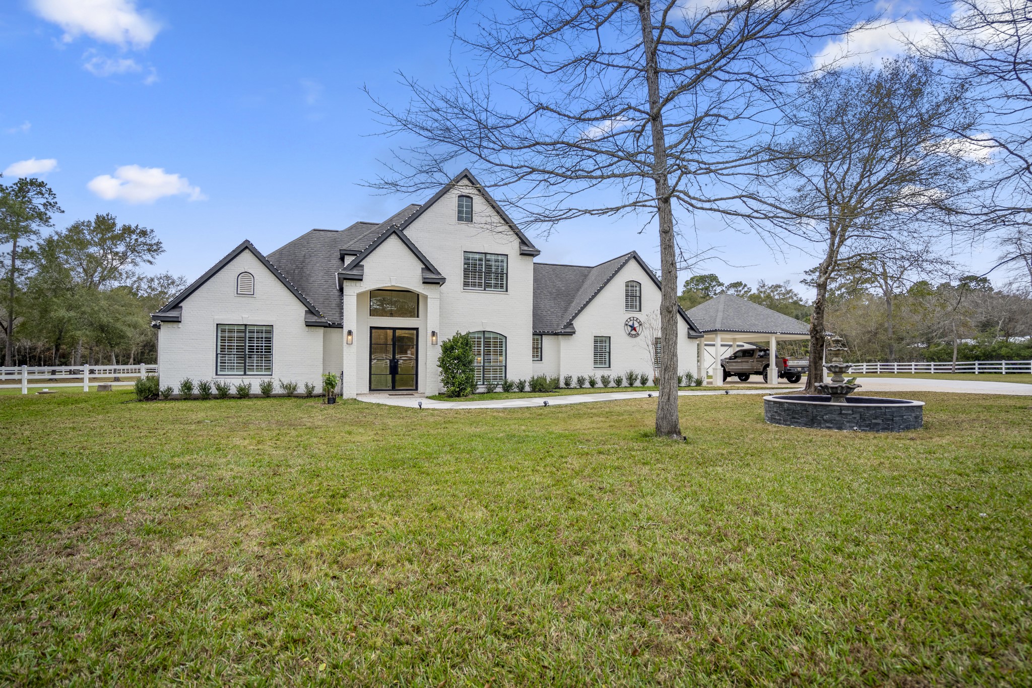 31219 Edgewater Drive Magnolia, TX 77354 - Photo 2 of 49 a view of a house with a yard and sitting area
