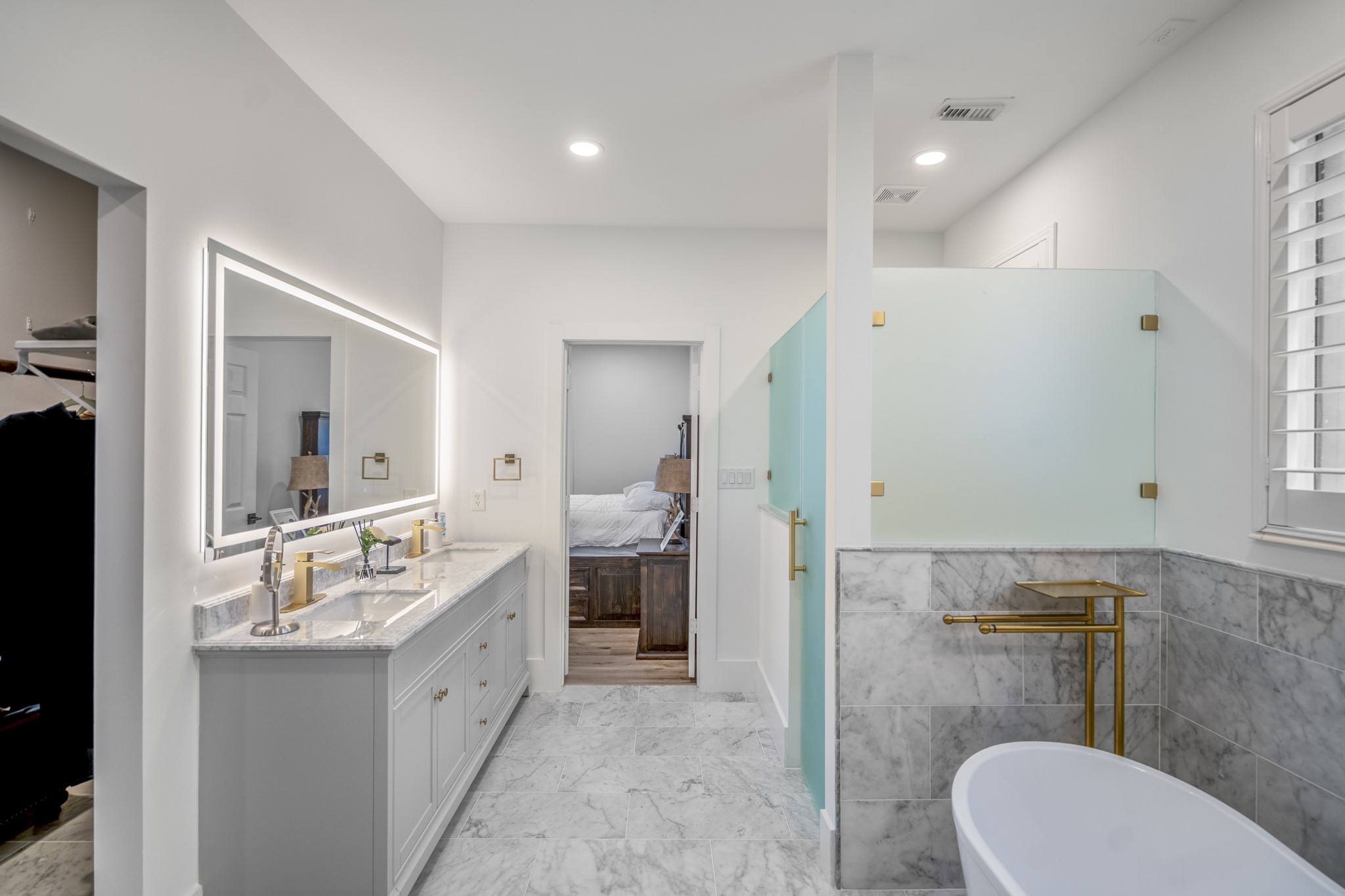 31219 Edgewater Drive Magnolia, TX 77354 - Photo 24 of 49 a bathroom with a double vanity sink toilet and mirror