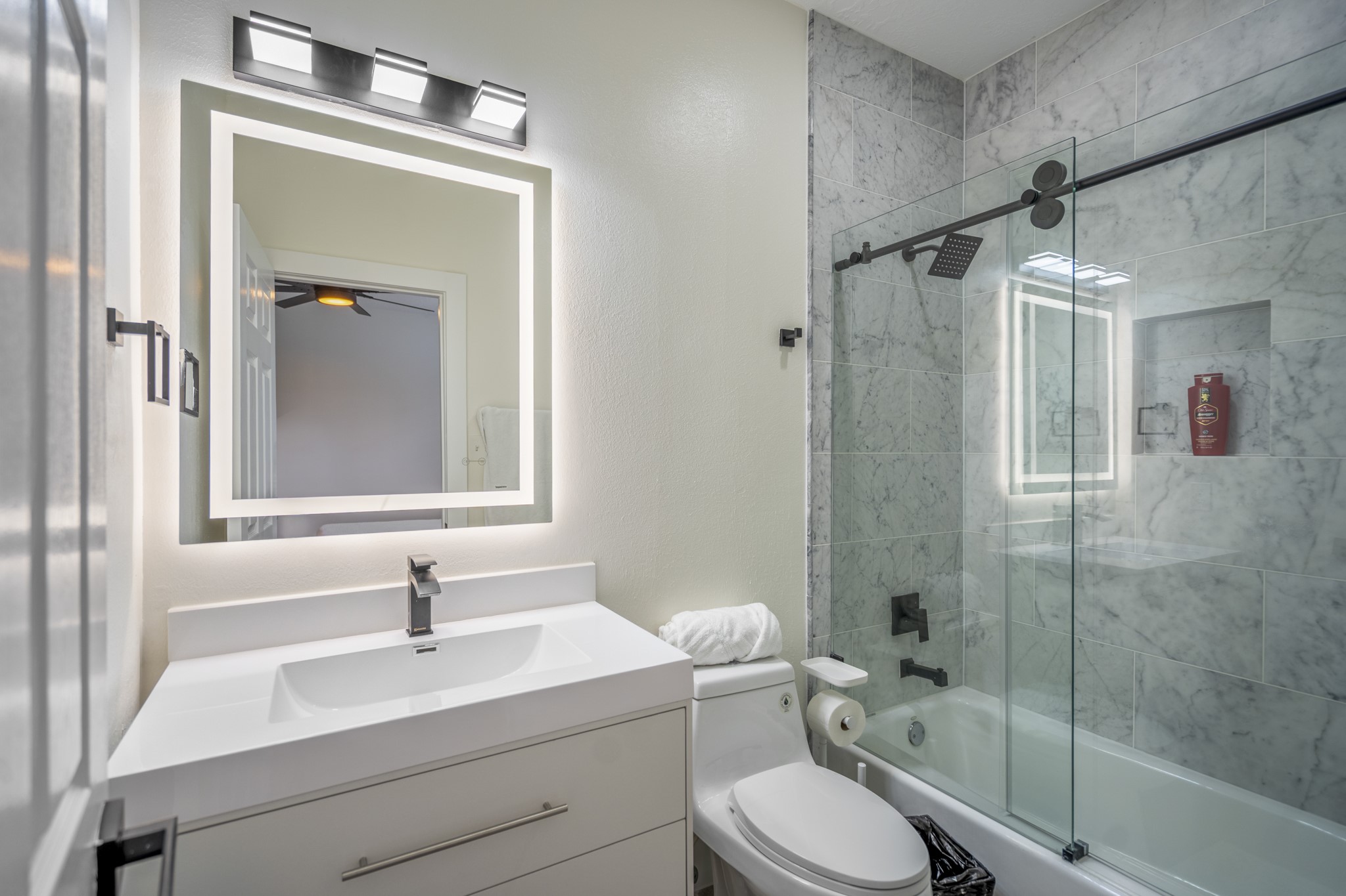 31219 Edgewater Drive Magnolia, TX 77354 - Photo 35 of 49 a bathroom with a sink toilet vanity and shower