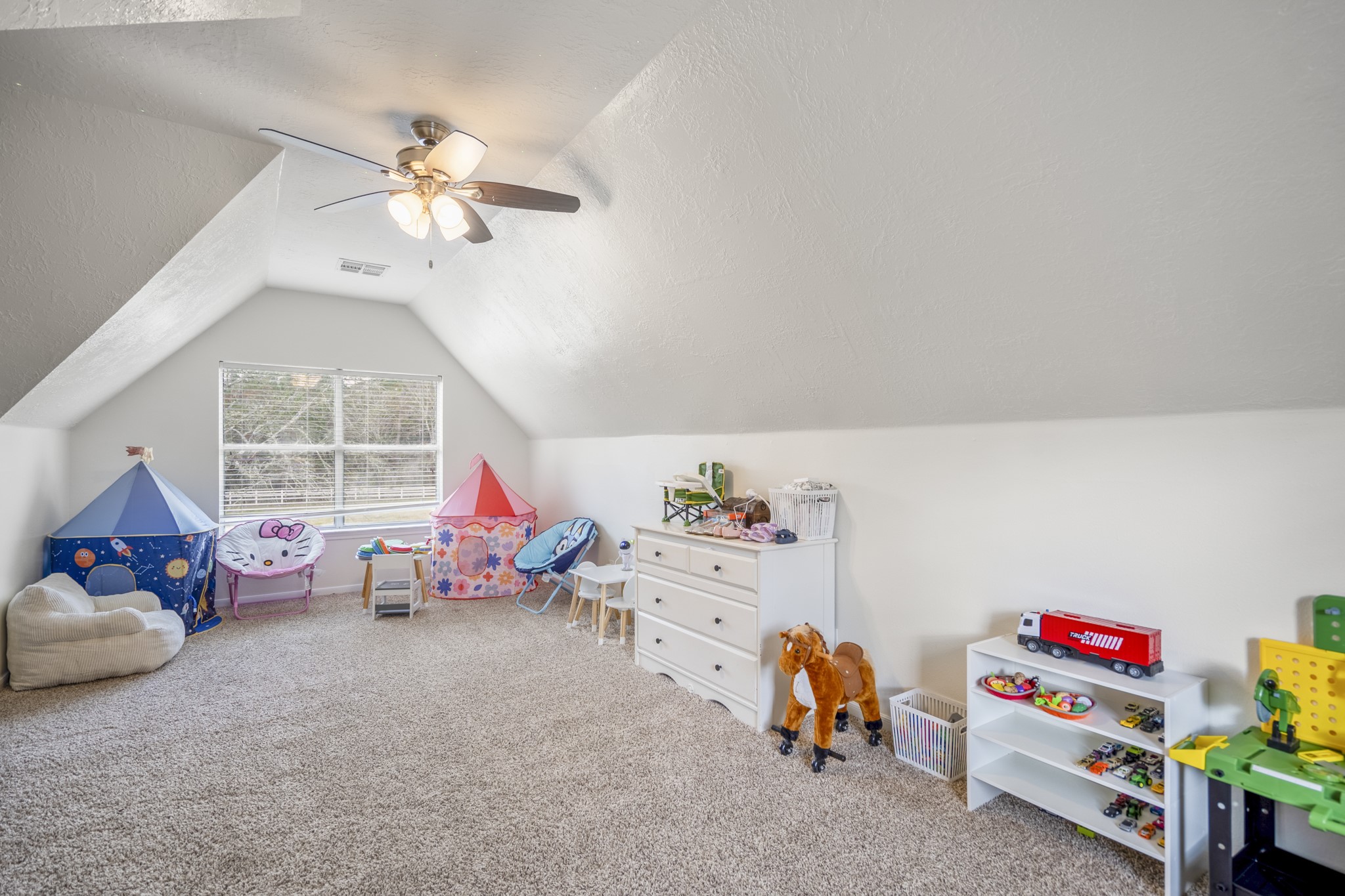 31219 Edgewater Drive Magnolia, TX 77354 - Photo 37 of 49 a children room with toys and a chandelier