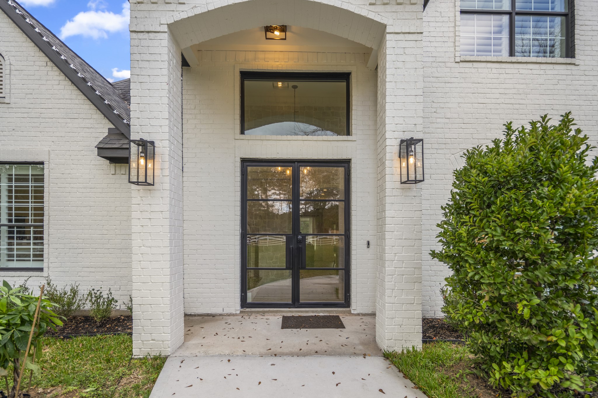 31219 Edgewater Drive Magnolia, TX 77354 - Photo 4 of 49 a front view of a house with a yard