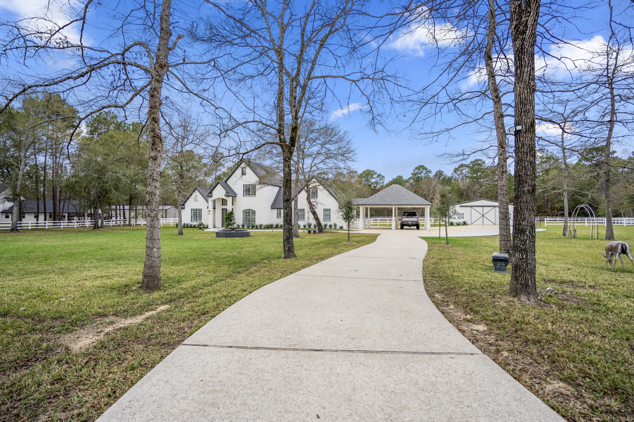 31219 Edgewater Drive Magnolia, TX 77354 - Photo 47 of 49 a front view of a house with a yard and large tree