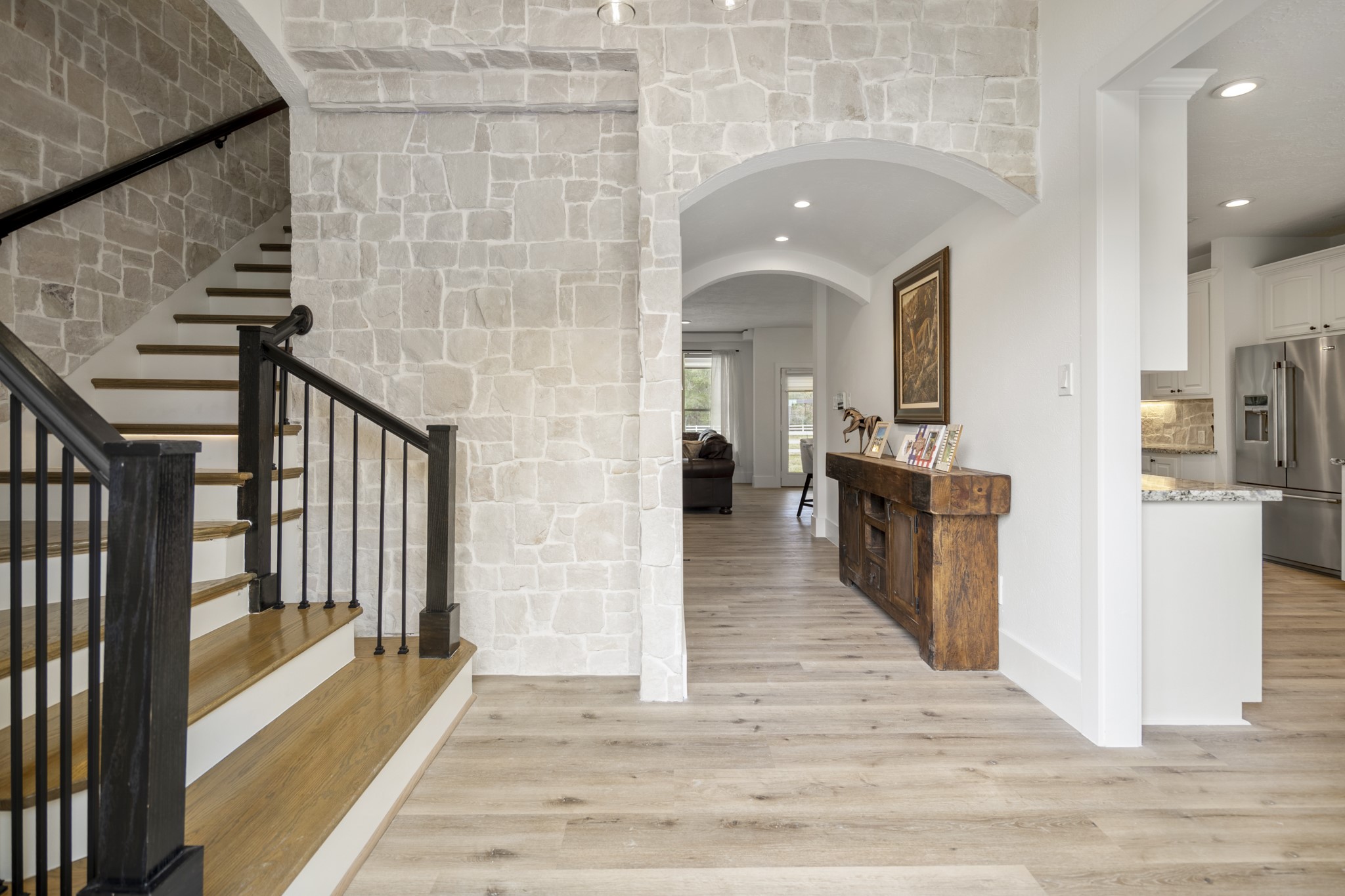 31219 Edgewater Drive Magnolia, TX 77354 - Photo 5 of 49 a view of a hallway with the wooden floor and staircase