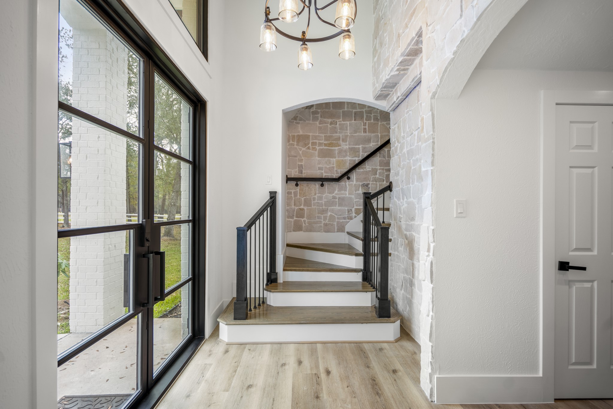 31219 Edgewater Drive Magnolia, TX 77354 - Photo 6 of 49 a view of staircase with wooden floor and window