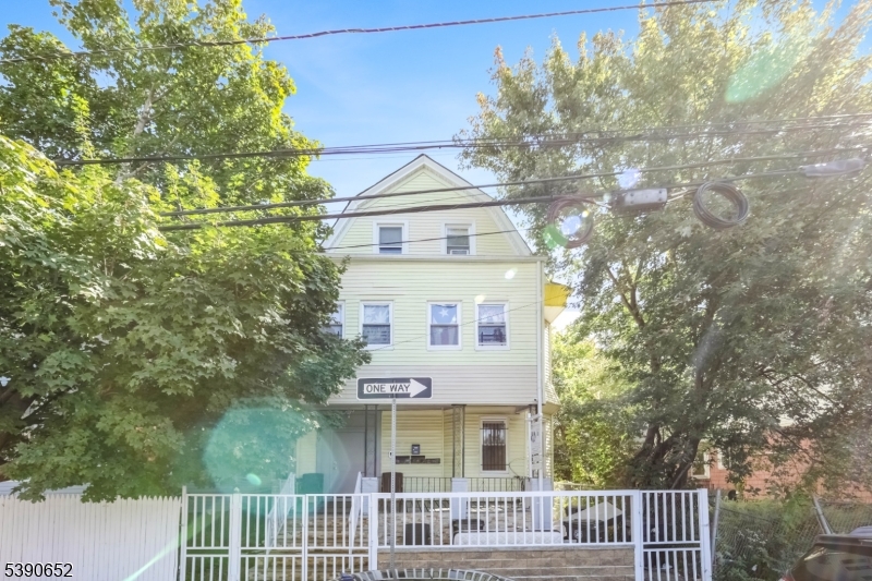 904 South 18th Street Newark, NJ 07108 - Photo 1 of 16 a front view of a house with a garden