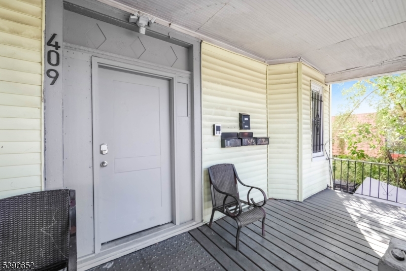 904 South 18th Street Newark, NJ 07108 - Photo 13 of 16 a workspace with wooden floor and a window