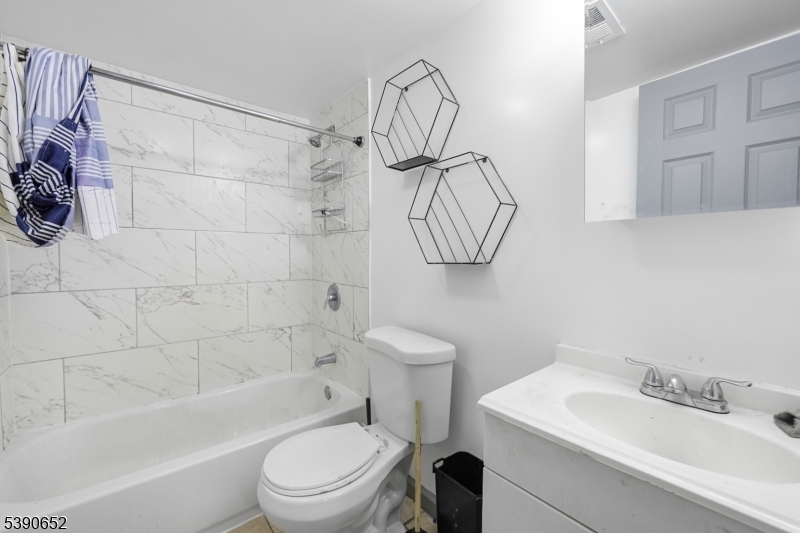 904 South 18th Street Newark, NJ 07108 - Photo 5 of 16 a bathroom with a sink a toilet and shower