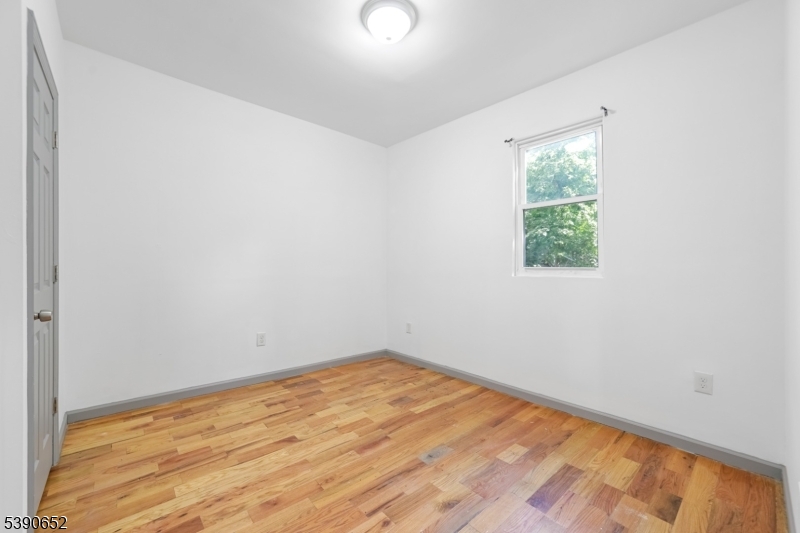904 South 18th Street Newark, NJ 07108 - Photo 10 of 16 an empty room with a window