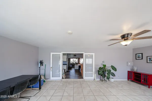a view of living room with furniture and a chandelier