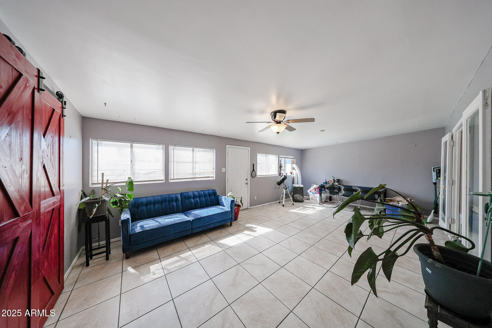 2037 West State Avenue Phoenix, AZ 85021 - Photo 16 of 18 a living room with furniture flowerpot and wooden floor