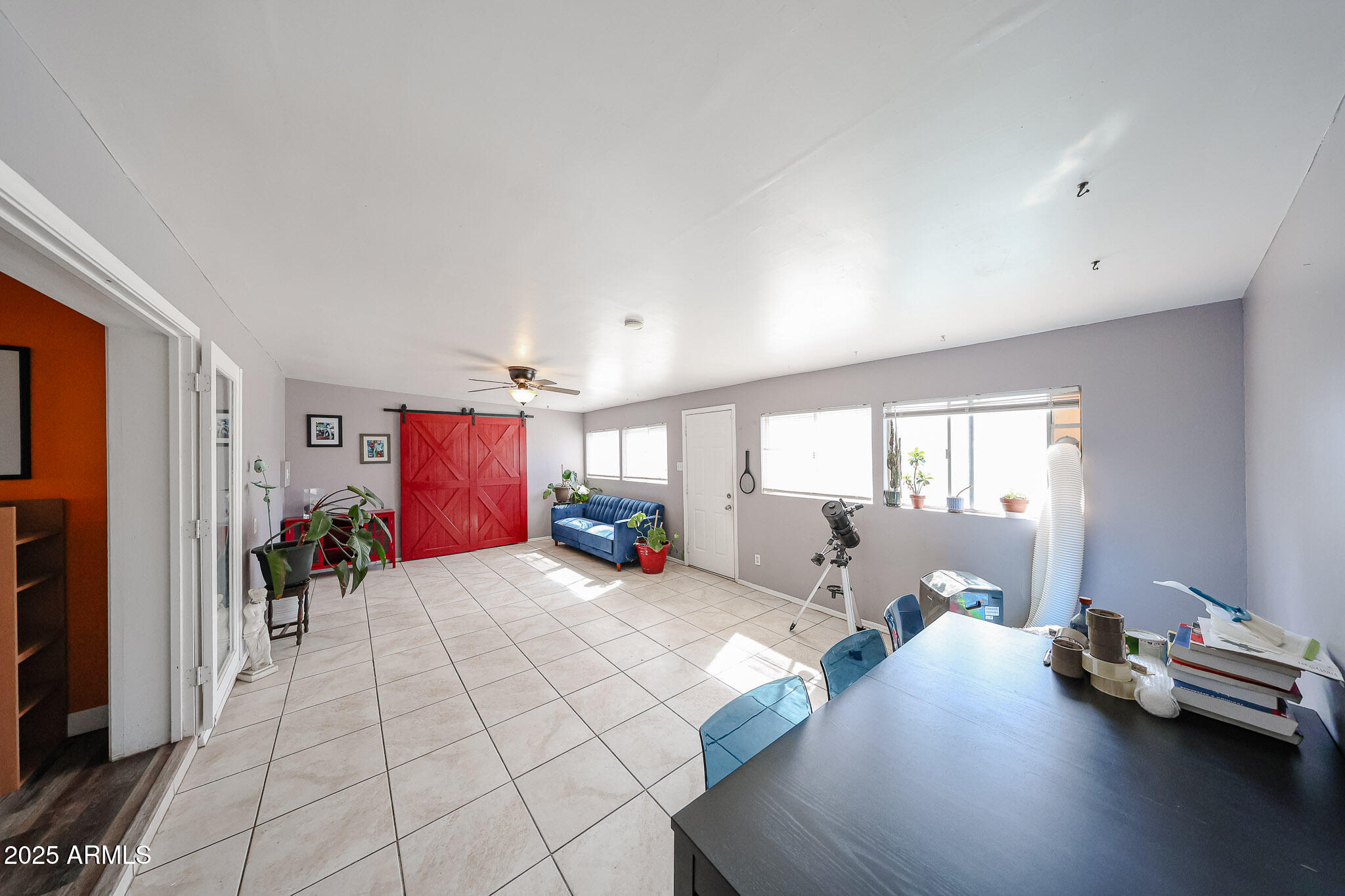 2037 West State Avenue Phoenix, AZ 85021 - Photo 17 of 18 a bed room with a bed and a couch