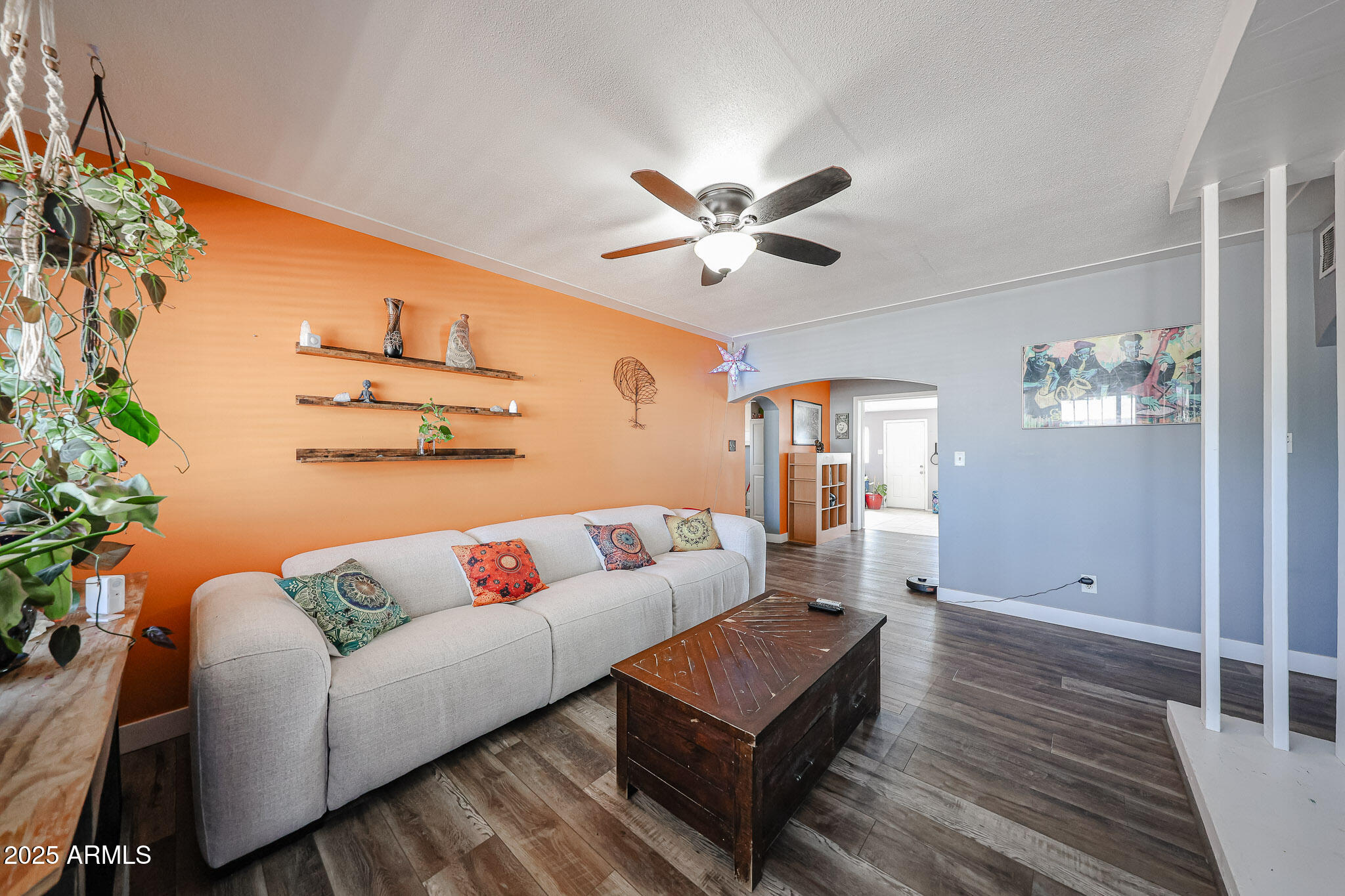 2037 West State Avenue Phoenix, AZ 85021 - Photo 2 of 18 a living room with furniture and a wooden floor