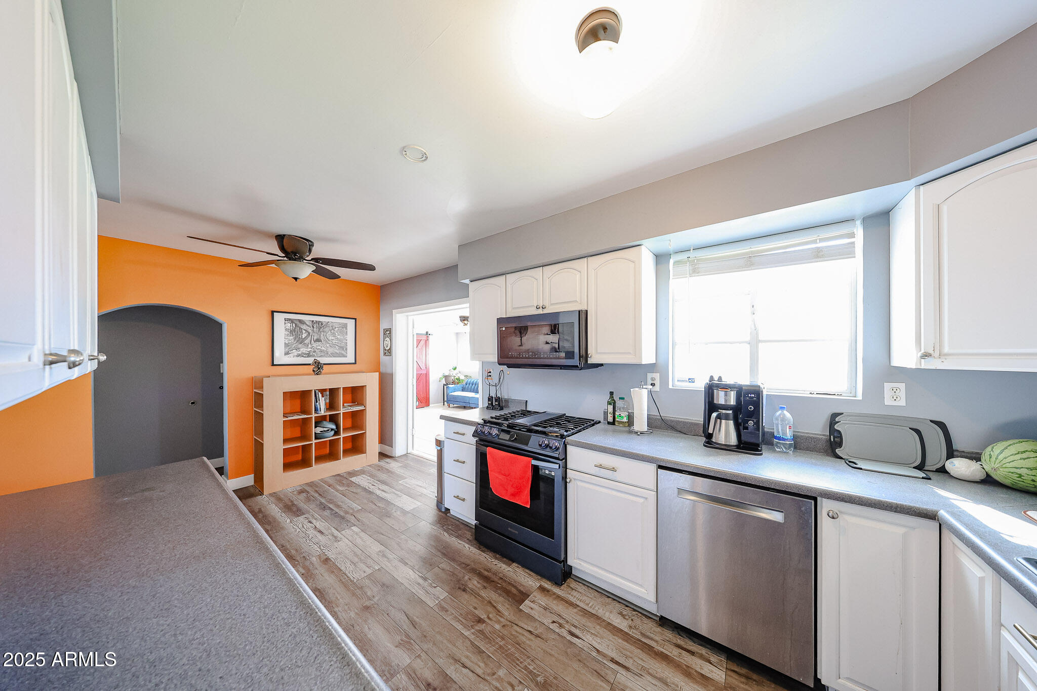 2037 West State Avenue Phoenix, AZ 85021 - Photo 4 of 18 a kitchen with stainless steel appliances granite countertop a sink stove and cabinets