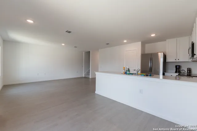 a view of a kitchen with a sink