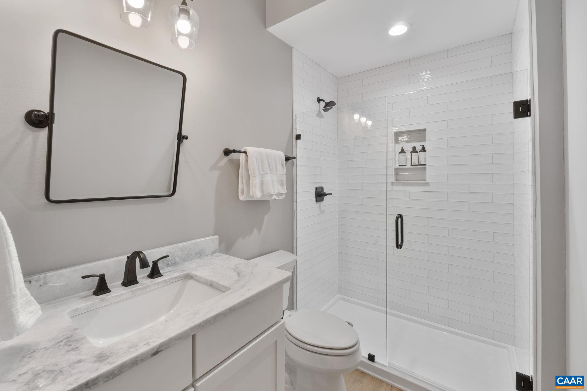 2206 Fowler Street Charlottesville, VA 22901 - Photo 42 of 59 Full bathroom attached to basement bedroom makes it perfect for guests or an in-law suite.