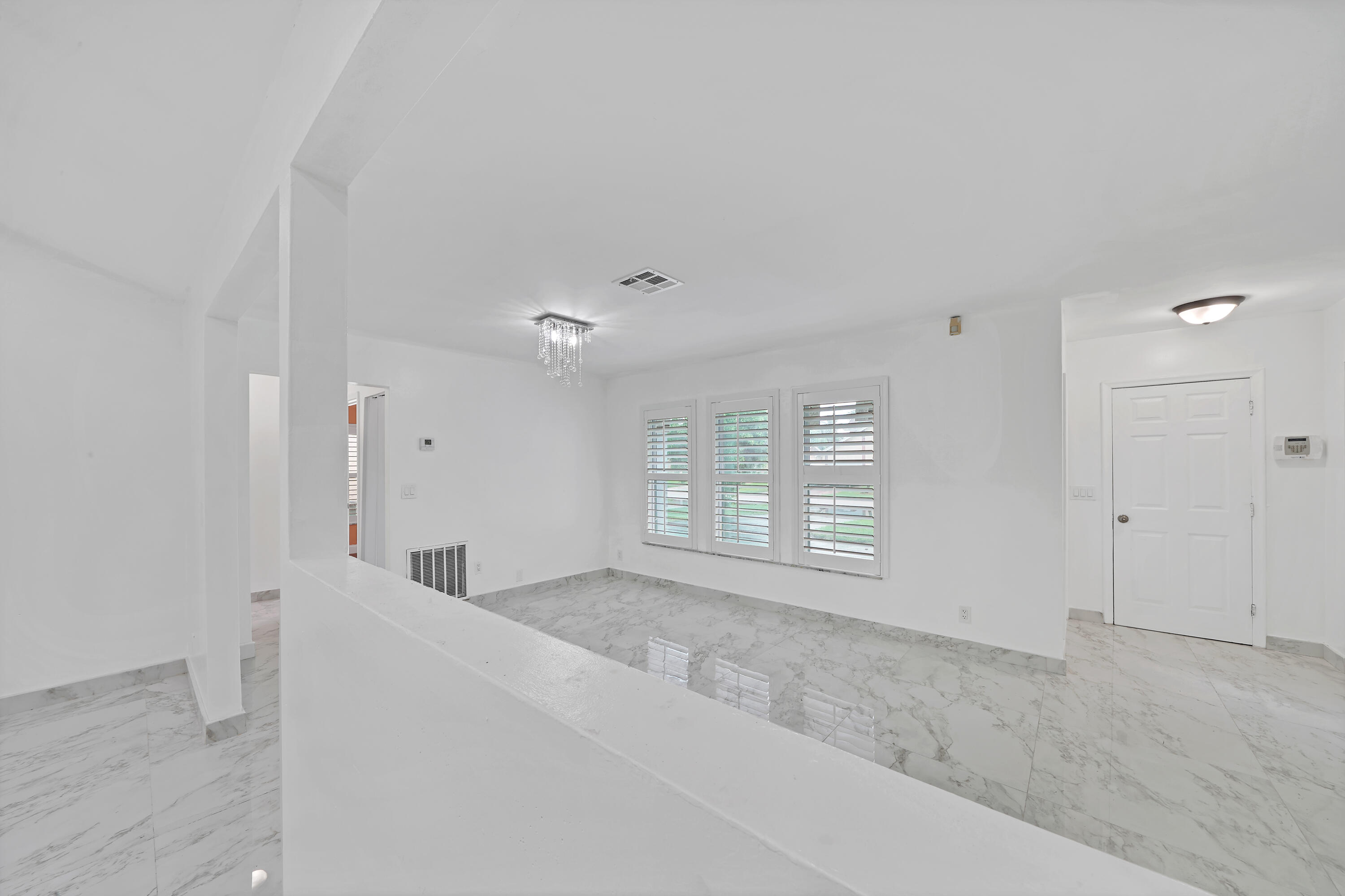 724 Ave Chaumont Delray Beach, FL 33445 - Photo 12 of 35 a view of an empty room with a window