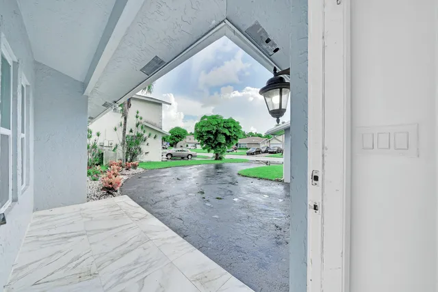 a view of a backyard of the house