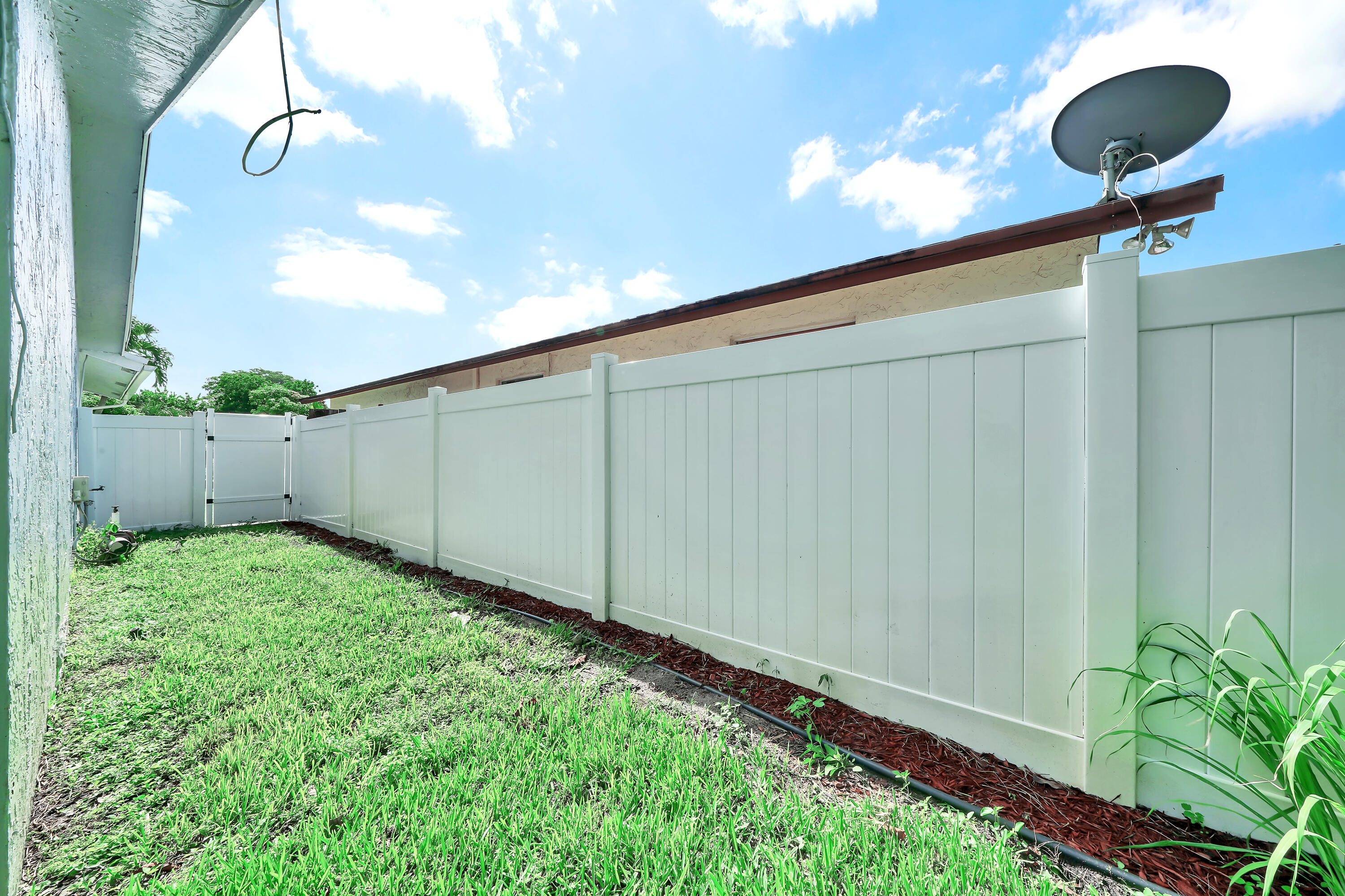 724 Ave Chaumont Delray Beach, FL 33445 - Photo 34 of 35 a view of a backyard