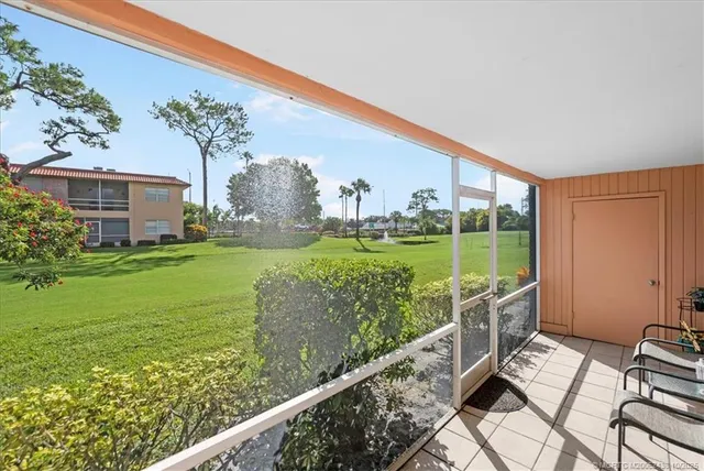 a view of a garden from a balcony