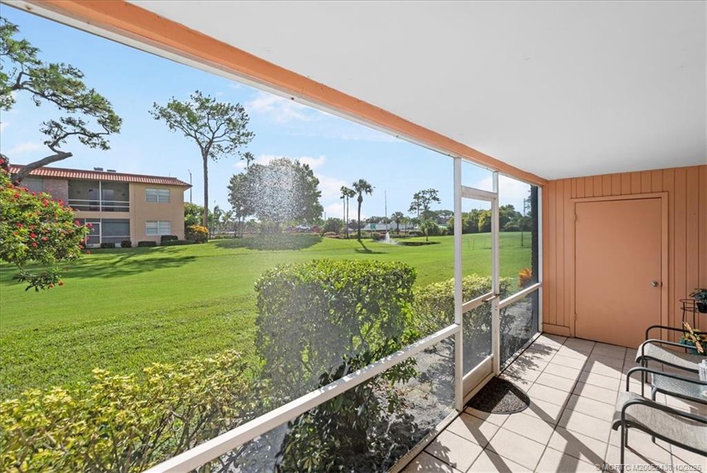 1969 Southwest Palm City Road, Unit C Stuart, FL 34994 - Photo 13 of 23 a view of a garden from a balcony