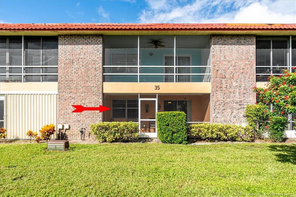 1969 Southwest Palm City Road, Unit C Stuart, FL 34994 - Photo 17 of 23 a front view of a house with a garden