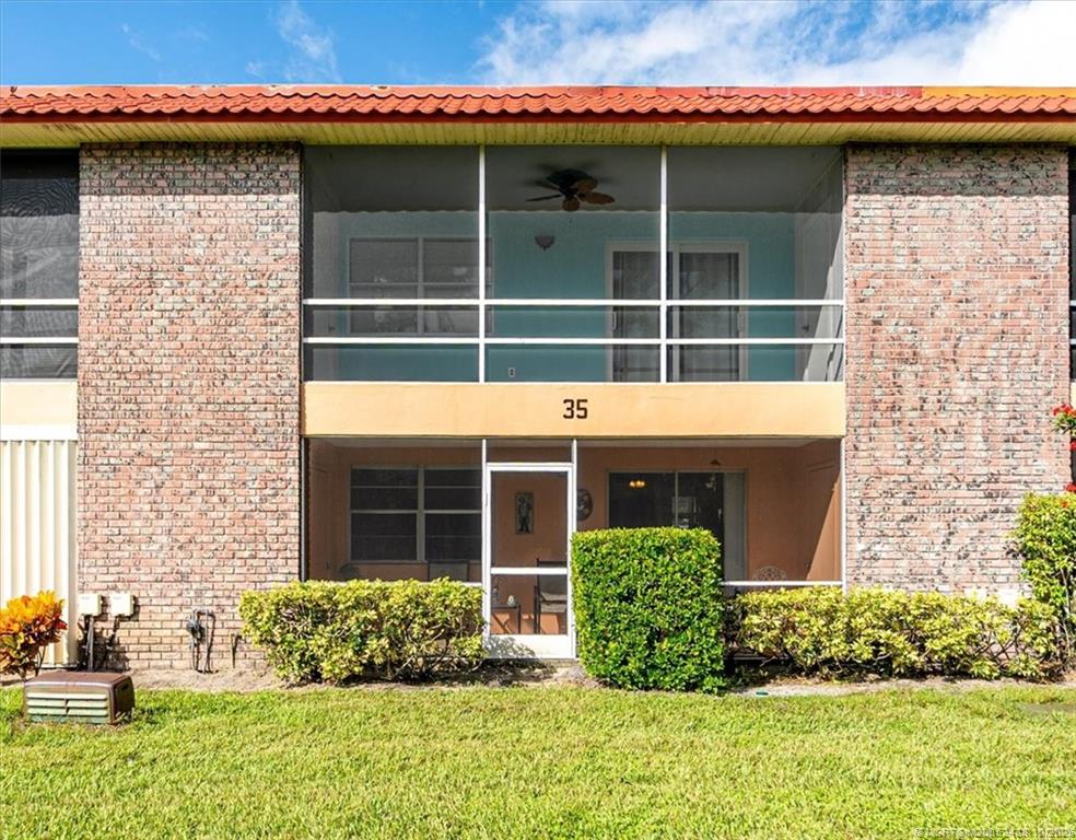 1969 Southwest Palm City Road, Unit C Stuart, FL 34994 - Photo 20 of 23 a front view of a house with garden