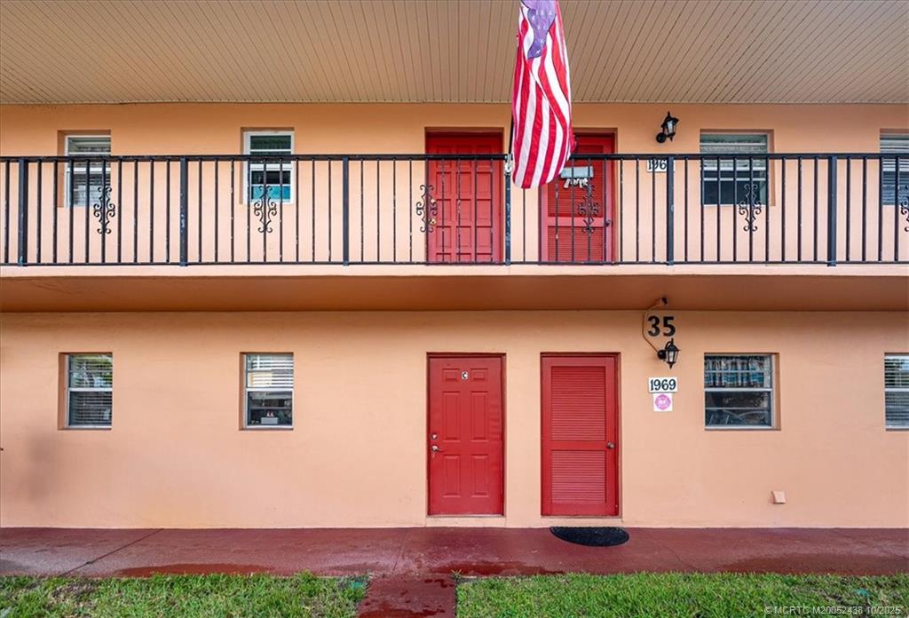 1969 Southwest Palm City Road, Unit C Stuart, FL 34994 - Photo 22 of 23 a view of a house with a yard