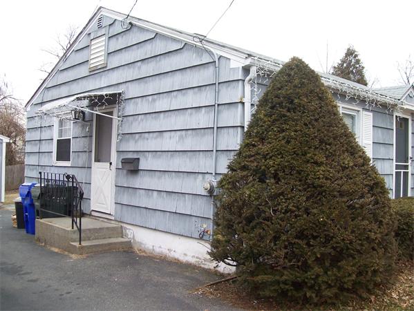 18 Embury Street Springfield, MA 01109 - Photo 4 of 14 a wooden bench sitting in front of a building