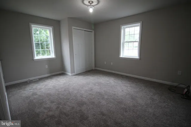 an empty room that has a window