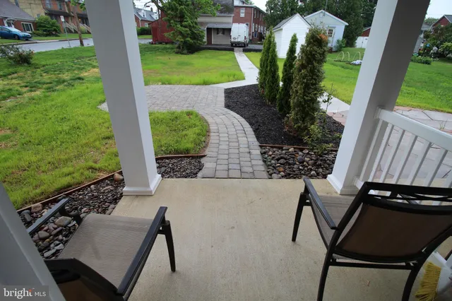 a view of backyard with seating area