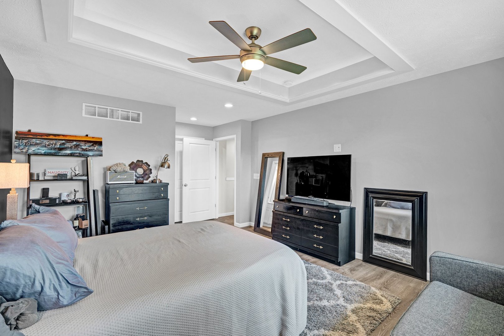 277 Cassidy Road Normal, IL 61761 - Photo 15 of 42 a bedroom with a bed and a flat screen tv