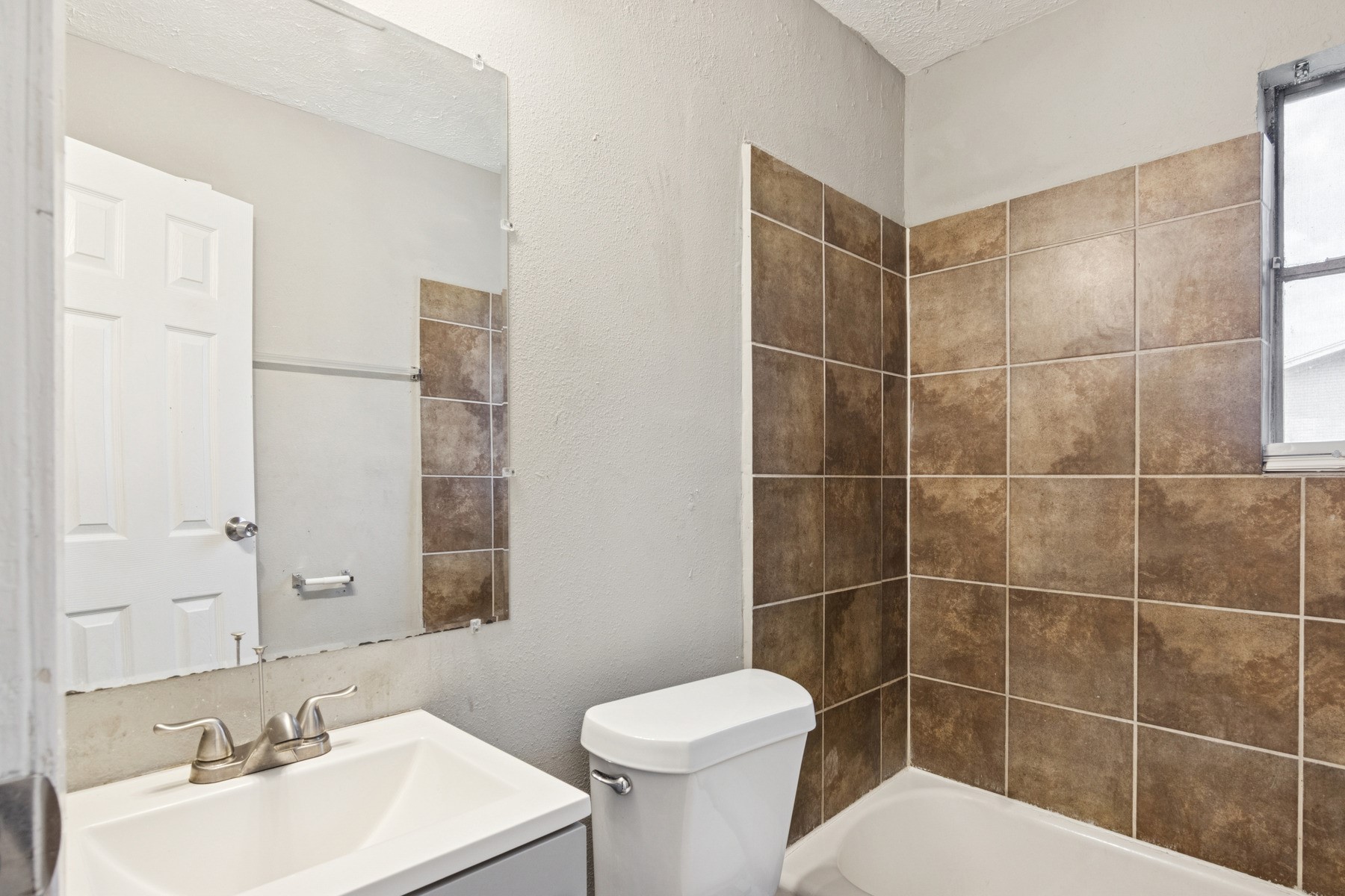 3631 North MacGregor Way, Unit 7 Houston, TX 77004 - Photo 12 of 12 a bathroom with a sink toilet and shower