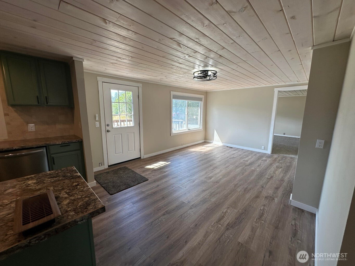 708 North Ridge Street Chewelah, WA 99109 - Photo 11 of 29 wooden floor in an empty room with a fireplace