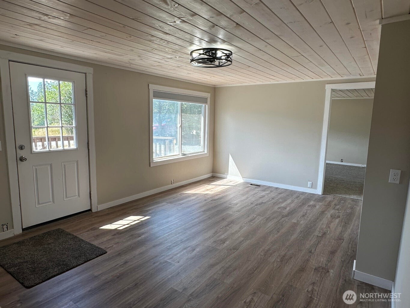 708 North Ridge Street Chewelah, WA 99109 - Photo 12 of 29 an empty room with wooden floor cabinet and windows
