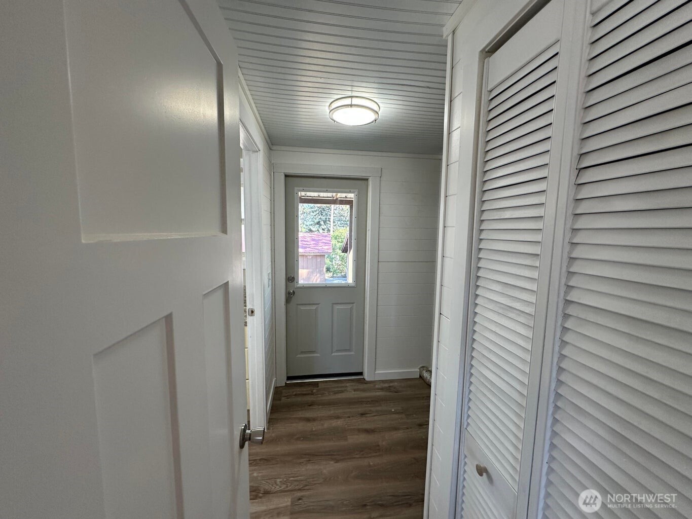 708 North Ridge Street Chewelah, WA 99109 - Photo 22 of 29 a view of a hallway with wooden floor and staircase