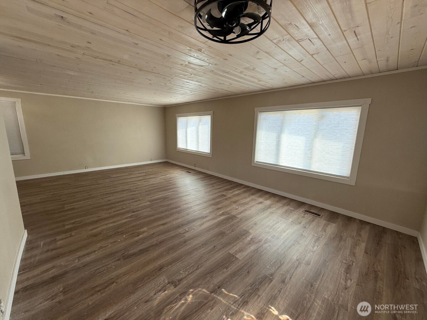 708 North Ridge Street Chewelah, WA 99109 - Photo 6 of 29 an empty room with wooden floor and windows