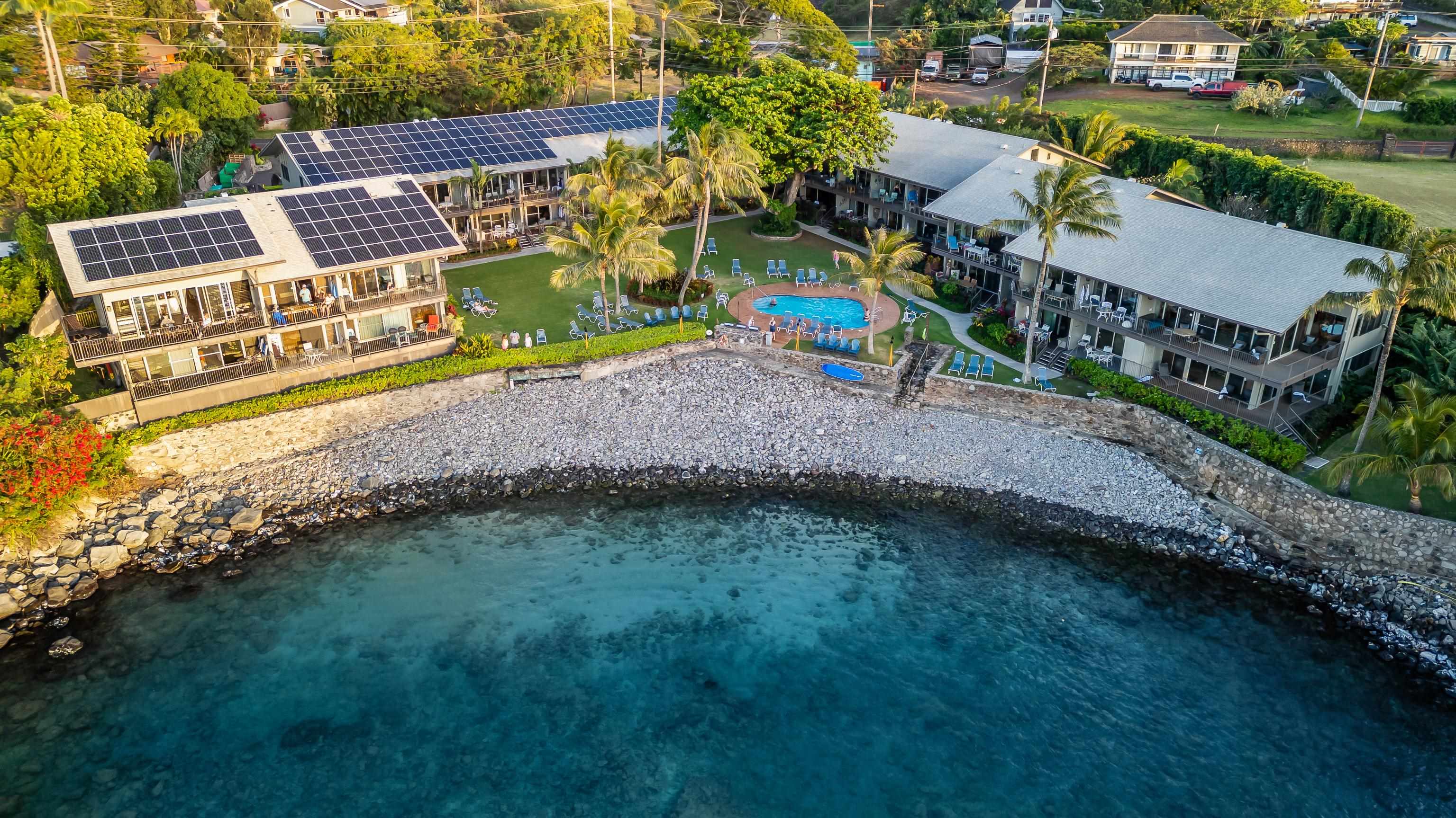 5255 Lower Honoapiilani Road, Unit 119 Lahaina, HI 96761 - Photo 16 of 22 an aerial view of a house with a yard and lake view