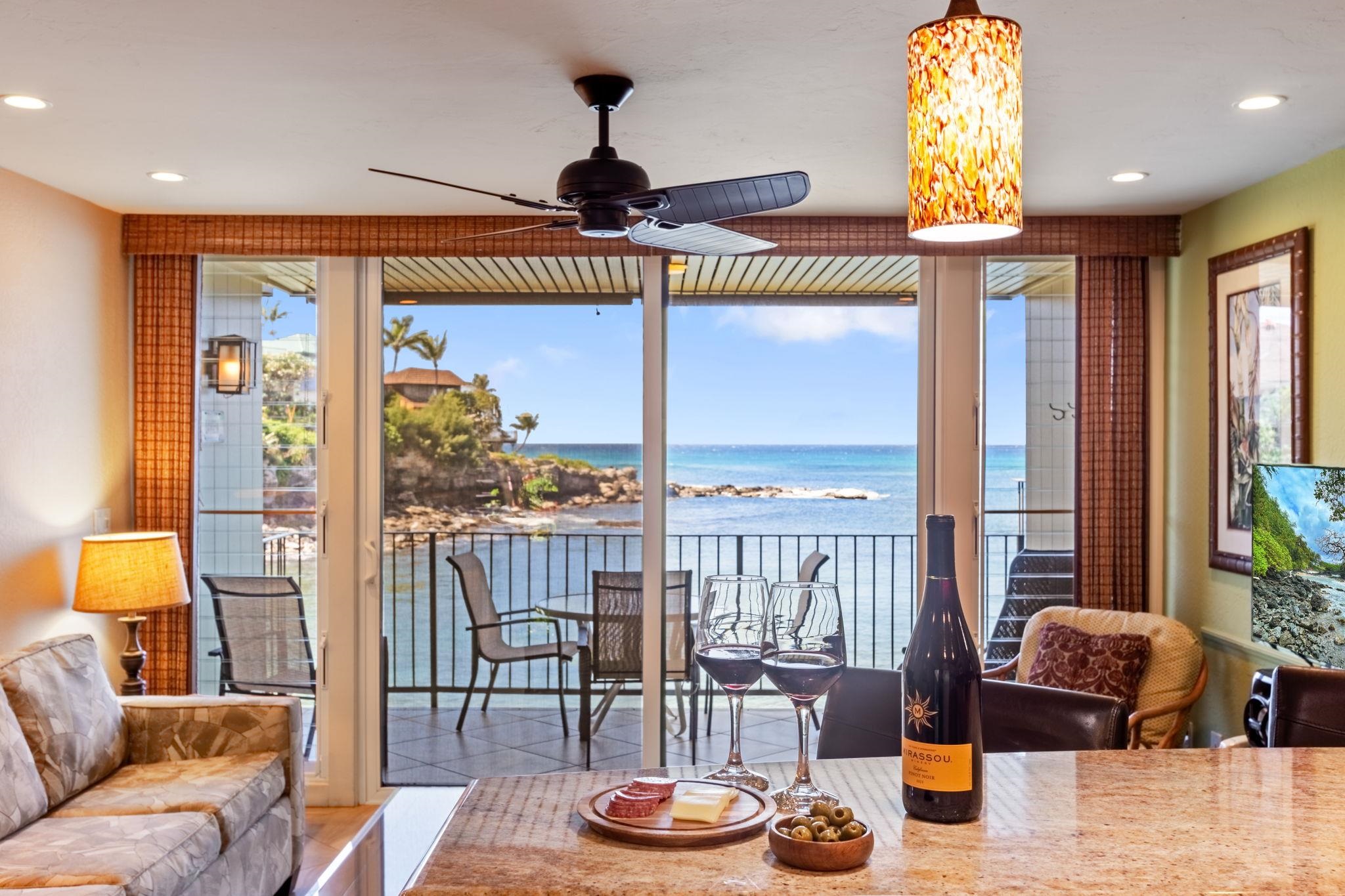 5255 Lower Honoapiilani Road, Unit 119 Lahaina, HI 96761 - Photo 2 of 22 a living room with furniture and a large window
