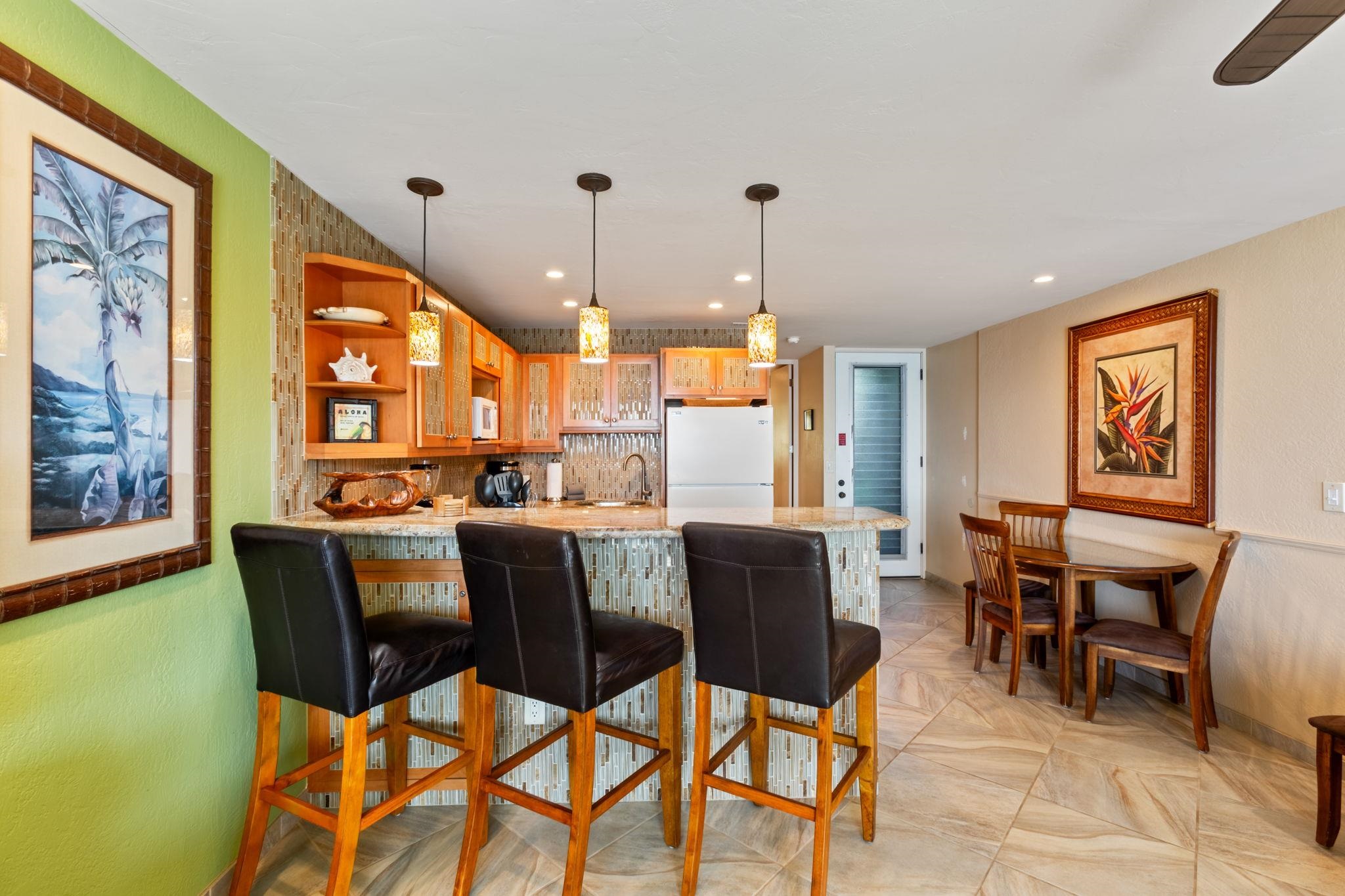 5255 Lower Honoapiilani Road, Unit 119 Lahaina, HI 96761 - Photo 6 of 22 a view of a dining room with furniture window and outside view