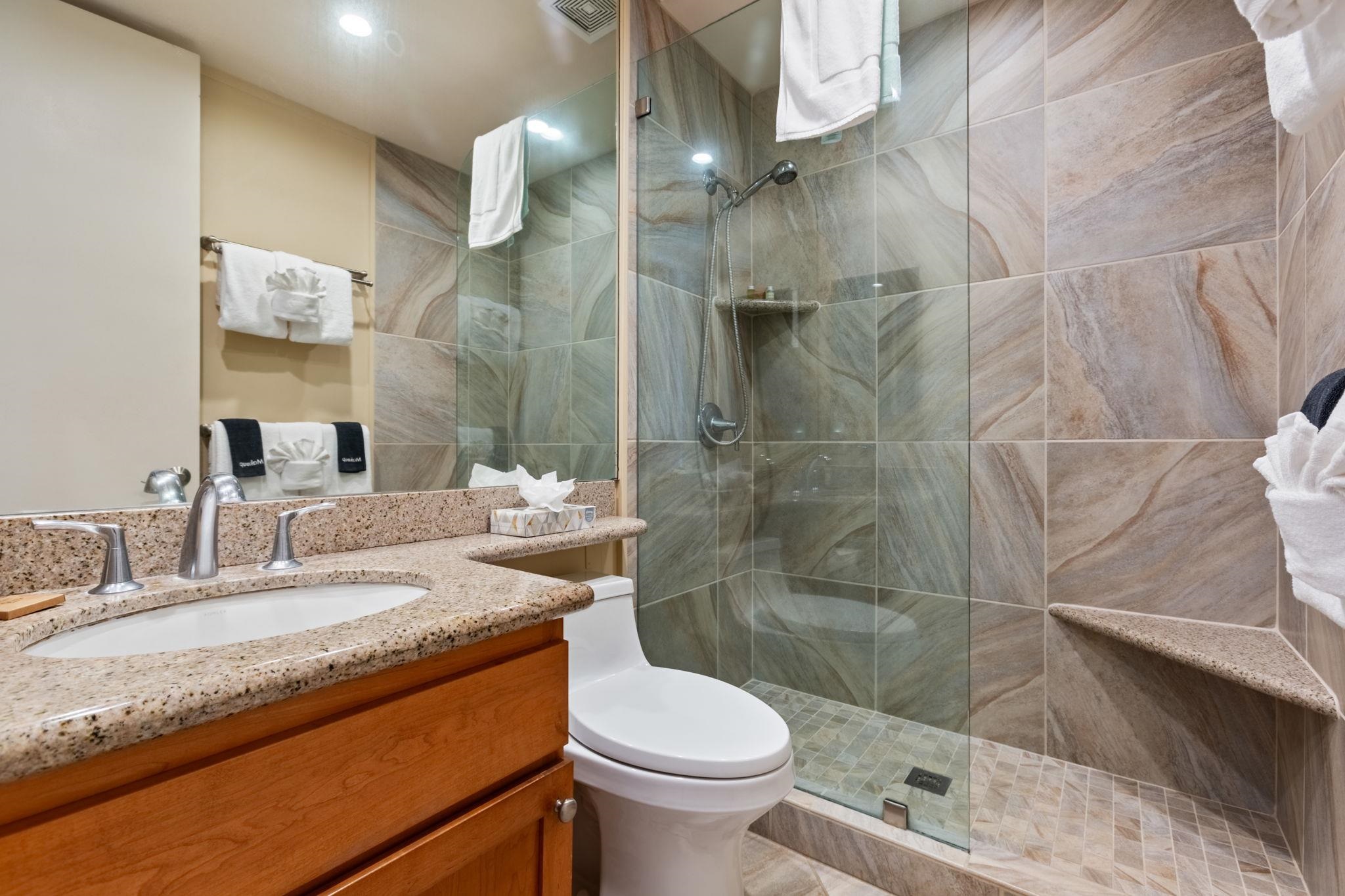 5255 Lower Honoapiilani Road, Unit 119 Lahaina, HI 96761 - Photo 7 of 22 a bathroom with a granite countertop sink toilet and shower