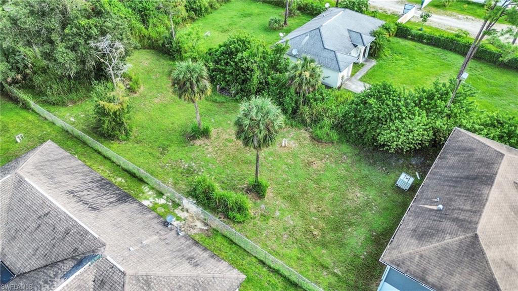 4015 16th Avenue Southeast Naples, FL 34117 - Photo 19 of 22 a backyard of a house with lots of green space